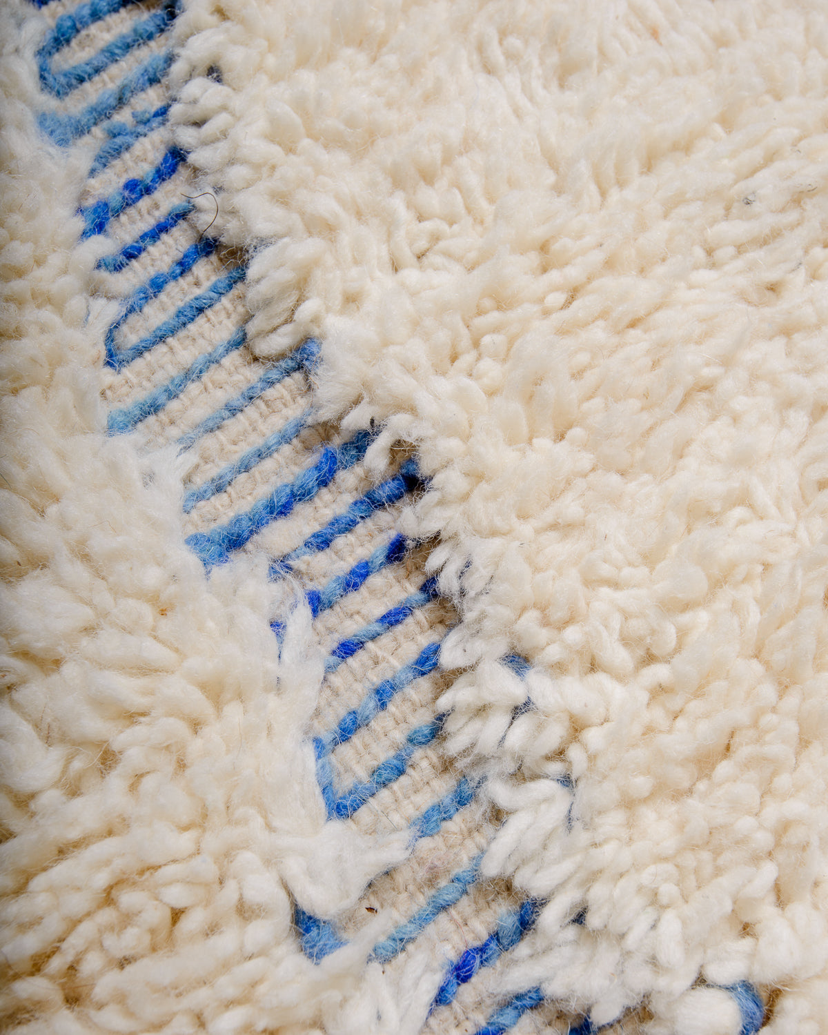 Modern, designer, handcrafted Berber rug from Morocco. Beniourain carpet with minimalist design, natural wool pile and a fluffy texture.